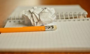 crumpled paper and pencil to represent LSAT burnout